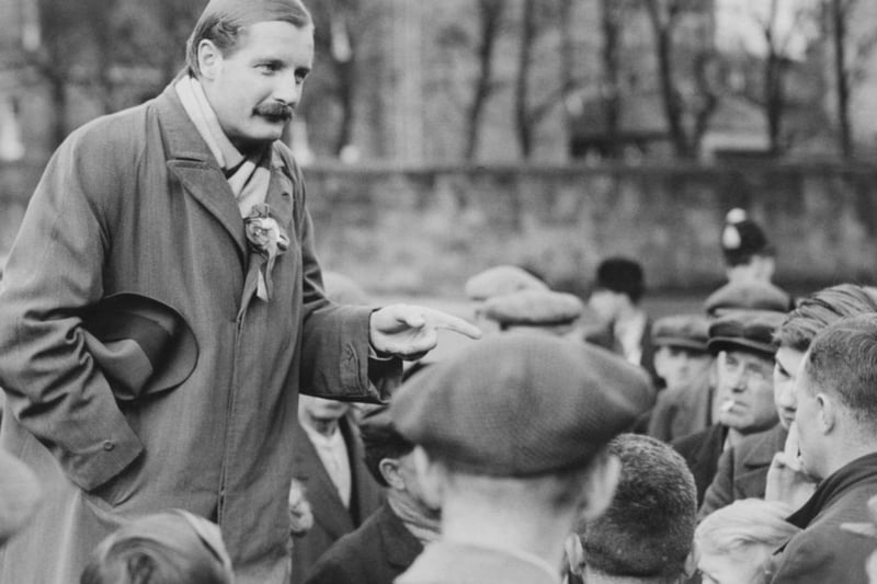 Oliver Baldwin (1899 - 1958), the son of British Prime Minister Stanley Baldwin, canvassing workers at Ferguslie Mills as the Labour candidate for Paisley, November 8 1935.