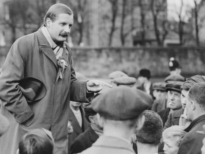Oliver Baldwin (1899 - 1958), the son of British Prime Minister Stanley Baldwin, canvassing workers at Ferguslie Mills as the Labour candidate for Paisley, November 8 1935.