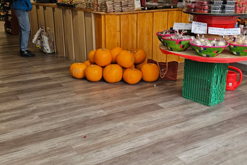Really large classic orange pumpkins can be found next to the till in Gloucester Road Fruits.