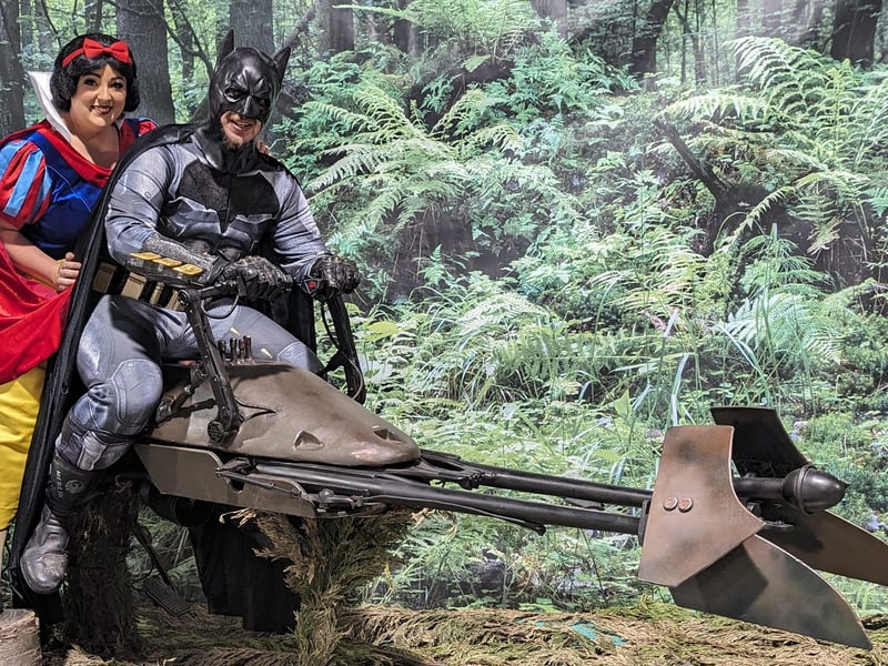 Batman takes Snow White for a ride.