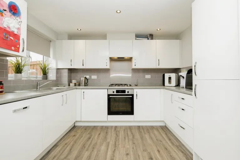 The modern kitchen with integrated appliances such as cooker, fridge/freezer and more.