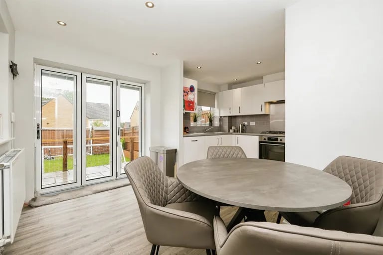 The open dining kitchen with bi-folding doors to the rear garden.