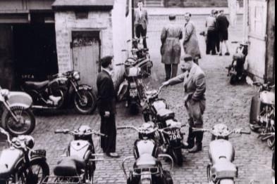 The rear of Weddell & Devine’s garage with newly stocked motorcycles - the club rooms for the Clydebank Motor Cycle Club were based here.