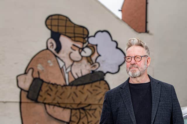 Pete McKee with The Snog mural at the Fagan's pub. Picture: Tony Johnson, National World