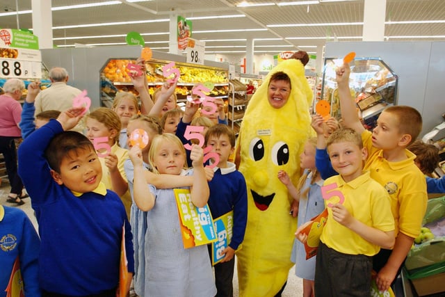 Barbara Ayre dressed as a banana to promote healthy living to pupils from Dame Dorothy Primary School in 2004.
Here they all are at the Grangetown store.