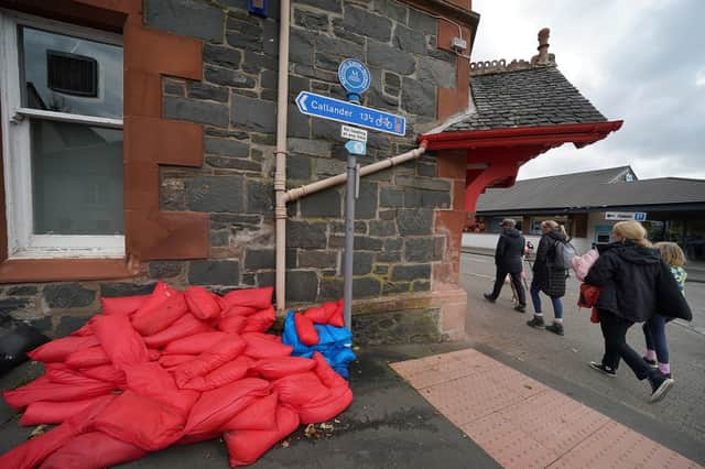 Sand bags piled against a wall in the main street in Aberfoyle in Perthshire