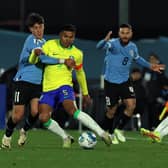 Uruguay's midfielder Facundo Pellistri (L) and Brazil's midfielder Casemiro (R) fight for the ball during the 2026 FIFA World Cup South American qualification football match between Uruguay and Brazil at the Centenario Stadium in Montevideo
