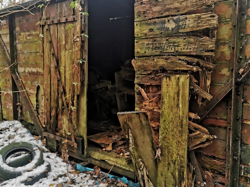 Sheffield's 'Railway Wagon Graveyard' is hidden within dense woodland on the city's outskirts, where the rotting remains of a number of wagon carriages and railway coaches remain. The urban explorer behind Lost Places & Forgotten Faces says it is one of the creepiest places he's ever visited. This picture shows the entrance to one of the old wagons. Photo: Lost Places & Forgotten Faces