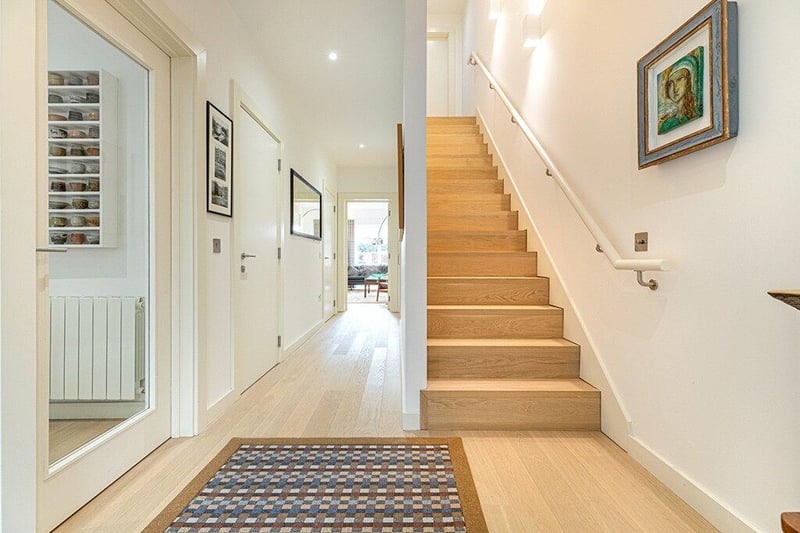 The lovely welcoming reception hallway benefits from natural light. The stunning oak tread stair leads to the first-floor level.