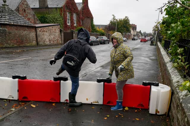 Flood defences have been erected in Brechin, Scotland as Storm Babet continues to pick up steam but all residents have now been instructed to leave the town. (Credit: Andrew Milligan/PA Wire)