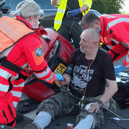 Biker Arthur Jepson is treated by Dr Steve Rowe and paramedic Tammy Williams.