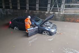Cars have been stranded under a bridge on Upwell Street in Sheffield today as Storm Babet continues to pour down.