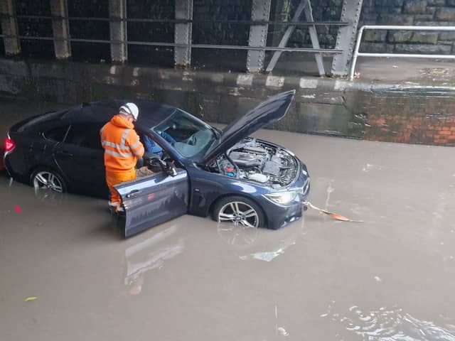 Cars have been stranded under a bridge on Upwell Street in Sheffield today as Storm Babet continues to pour down.