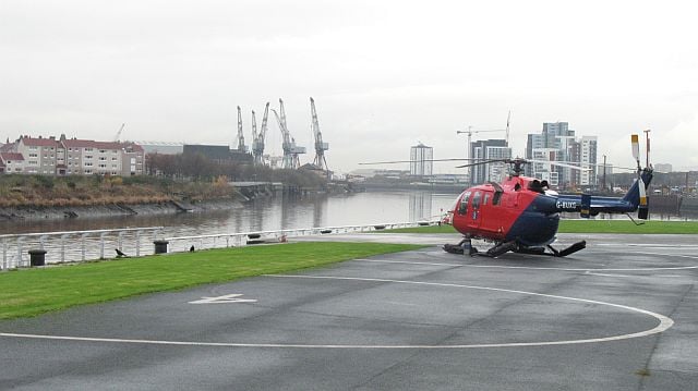 We might be stretching the definition of airport with this heliport, but hey, they’re aircraft right? Glasgow City Heliport can be found in Govan on Linthouse Road nearby the Queen Elizabeth University Hospital. The heliport is owned and operated by Babcock Mission Critical Services Onshore Ltd and is the operating base for the Police Scotland’s  air support unit.  Prior to May 2014, the heliport was located about one and a half miles east from its present location - nearby the Glasgow Seaplane Terminal -within the grounds of the Scottish Exhibition and Conference Centre and directly across the River Clyde from the Glasgow Science Centre. Planned future development of the SECC area enforced the move. The heliport can also handle an amount of passenger traffic - although facilities are limited at the small heliport - with priority given to Police. The ground facilities consist of a maintenance hangar building and parking for six small to medium-sized helicopters.