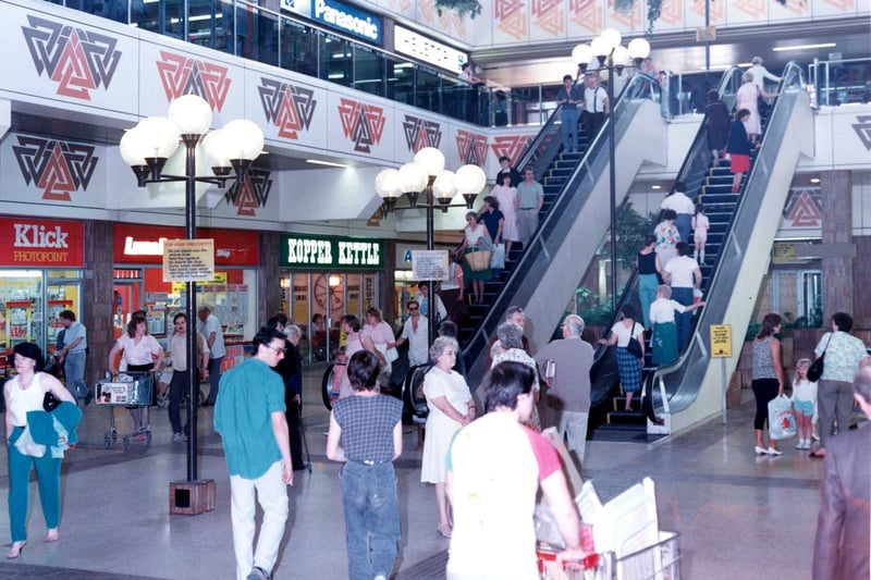 Shoppers at the escalators in Phase 4 of Cumbernauld Town Centre.