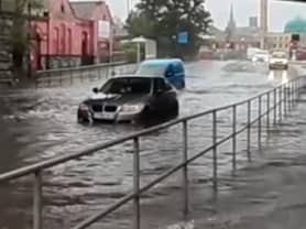 Car stranded in flood water at Heeley Bridge