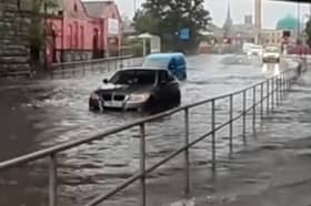 Car stranded in flood water at Heeley Bridge