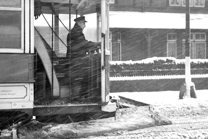A snowplough tram clears a path through a winter storm in 1941.