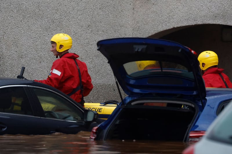 Dozens of cars were flooded by the rising waters.