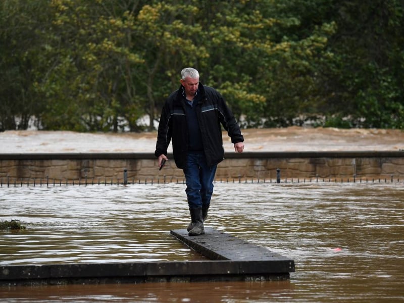 A resident looks at the level of flooding in Brechin on Friday, October 20.