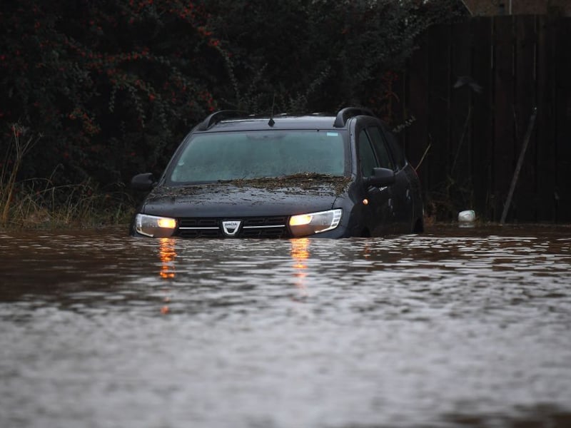 A vehicle stuck in a flooded street in Brechin.