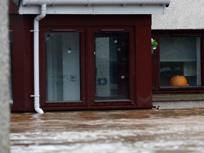 Flood water levels reach as high as the window sills of a house in Brechin.