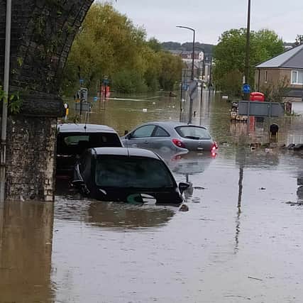 Cars submerged in flooded Catcliffe 