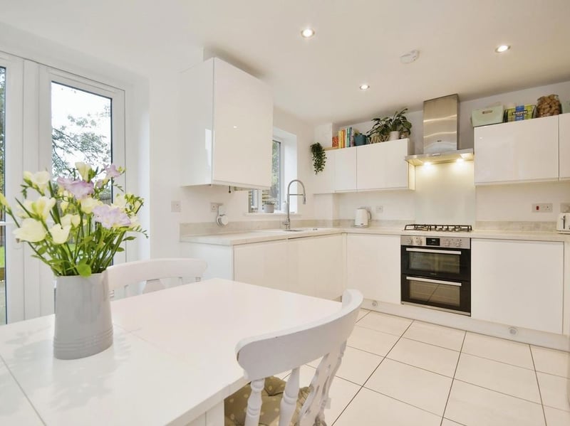 The modern kitchen offers access to the rear garden. (Photo courtesy of Zoopla)