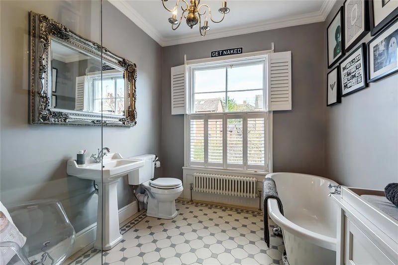 The large family bathroom with a bathtub and separate walk-in shower.