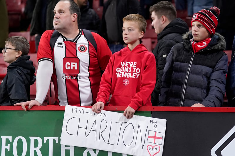 Sheffield United fans in the stands with a tribute in memory of Sir Bobby Charlton. Picture: Danny Lawson/PA Wire