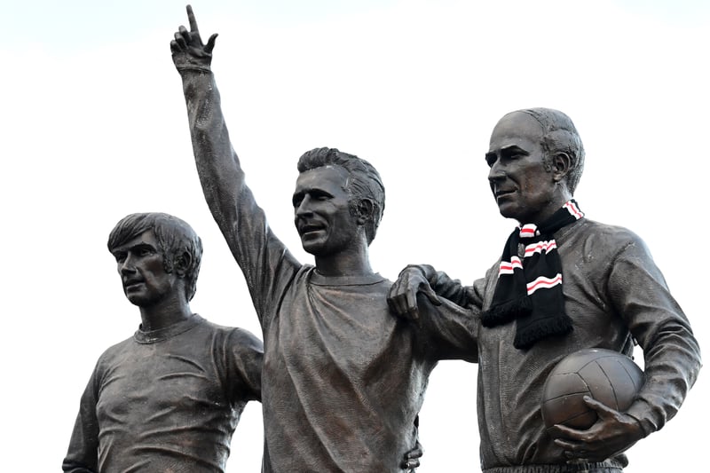A scarf is pictured wrapped around a sculpture of Bobby Charlton, along with former Manchester United players George Best, Denis Law, forming the 'United Trinity' sculpture, outside of Old Trafford