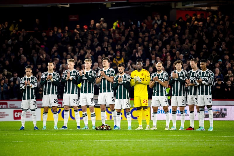 Players of Manchester United take part in a minutes applaud in memory of Manchester United and England midfielder Bobby Charlton 