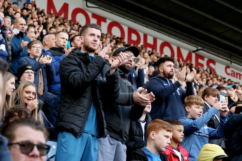 Fans on their feet showing their support to Ched Evans