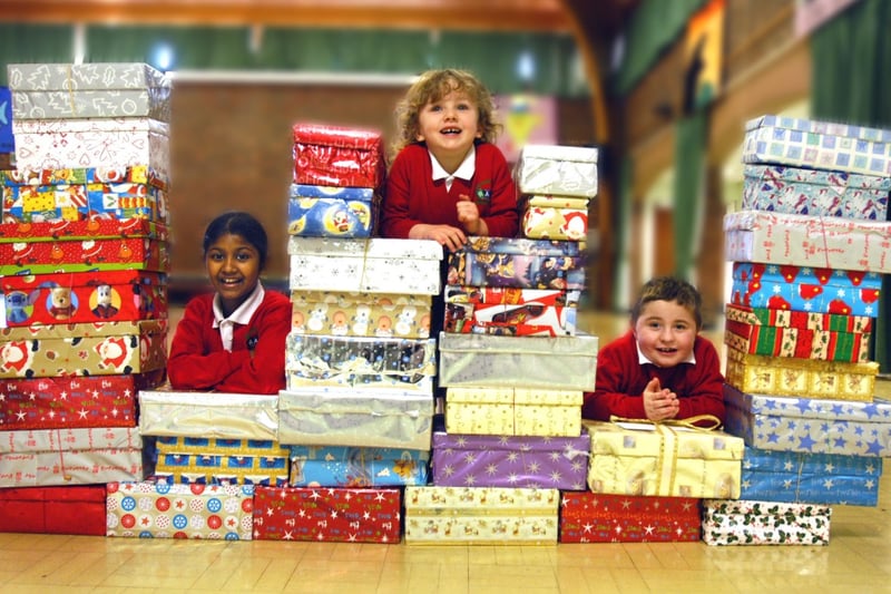 Samin Akhtar, Meghan Peacock and Owen Cullen have every right to look pleased with their efforts for the Shoebox Collection Appeal in 2006.
