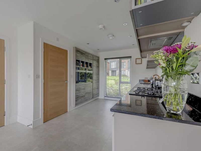 The kitchen has two overs, integral fridge freezer, hob with extractor fan and dishwasher. (Photo courtesy of Zoopla)