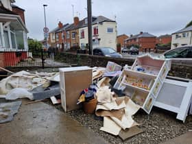 Soiled furniture and sentimental items are laid outside houses in Catcliffe, waiting to be discarded by the council.