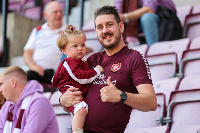 A Hearts fan teaching the next generation the life of a Jambo at Tynecastle.