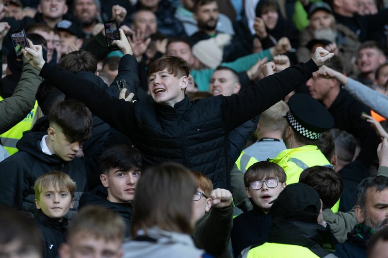 A young Hibs fan supports his team at Ibrox.