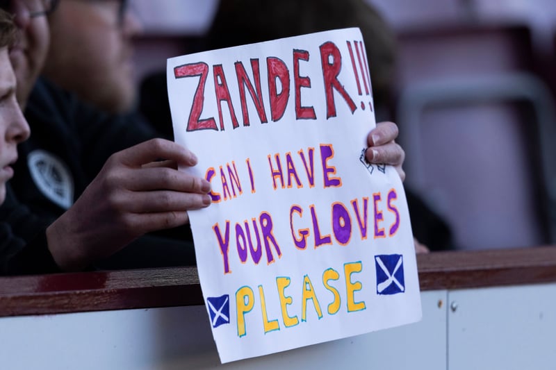 A Hearts fan requests the gloves of goalkeeper Zander Clark during the recent fixture against Celtic.