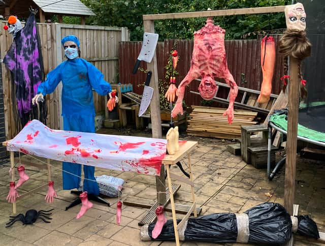 One of the centrepieces of Michael's display in Kestrel Close is this zombified surgeon, complete with operating table and rack of spare limbs.
