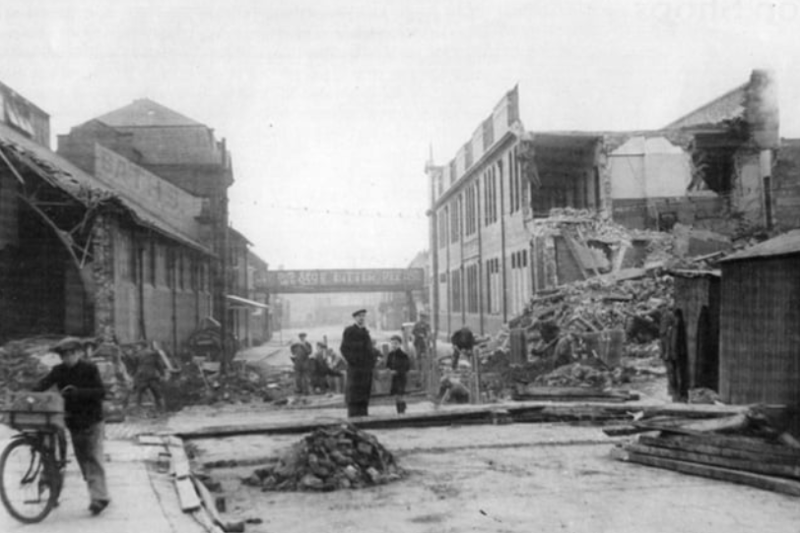 Surveying the ruins from an air raid on Derby Street in 1941, but locals still went on with their business. Photo: Shields Gazette