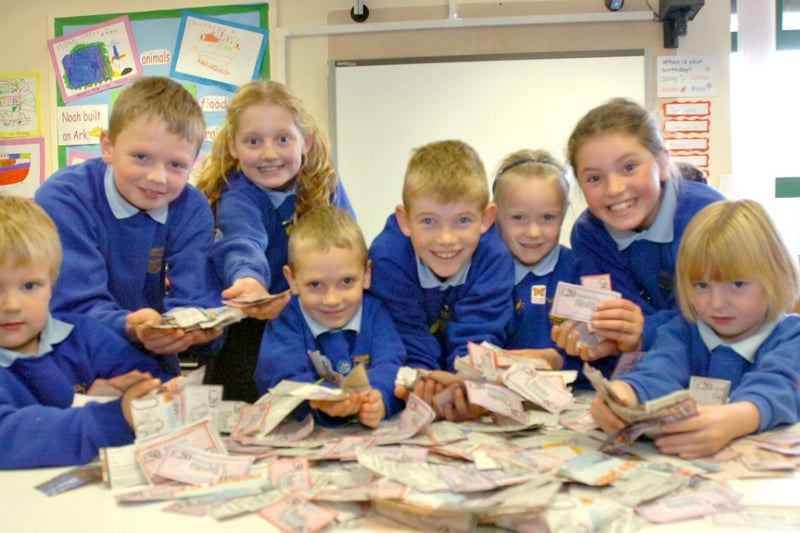 Pupils at St Benet RC School with some of the Barclays Books for Schools vouchers they collected in 2008.