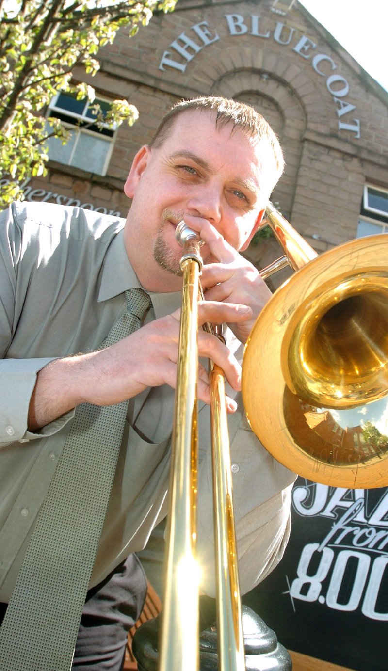 John Wall, manager of The Bluecoat in Rotherham, pictured outside the pub in May 2005. The trombone player had just launched jazz nights at the pub, making it the first Wetherspoons in the country to have live music