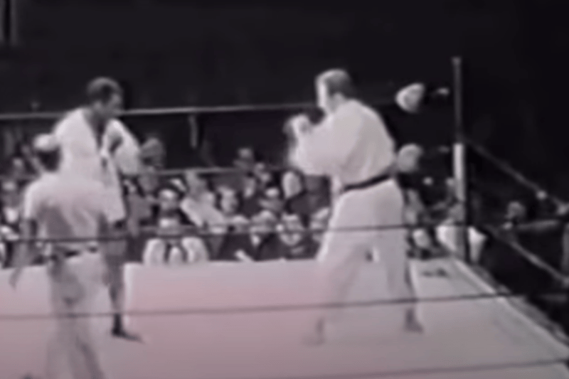 Three decades before the UFC was founded in 1993 - wrestler Gene LeBell challenged experienced boxer Milo Savage to a professional wrestling bout dubbed ‘“Something New for Sports Fans.”  During the fight LeBell used his judo to throw Savage to the canvas, before choking the boxer unconscious.  The bout was seen as a precursor to modern MMA and Le Bell went on to feature in several movies whilst also becoming a close friend of UFC icon Ronda Rousey in later years.(YouTube)
