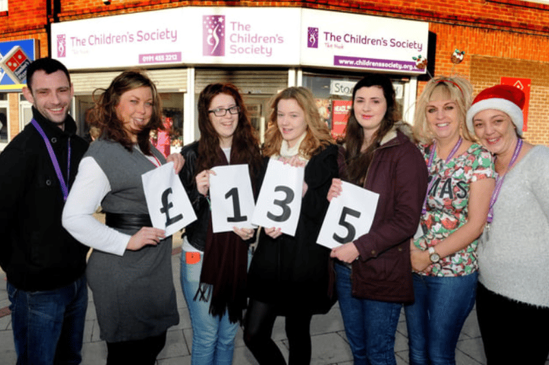 Kathryn Green, Hannah Olsen, Emily Cawkwell and Kate Stephenson, handed over £135 to Children Society volunteers Dave Evans, Prince Edward Road shop manager Carole Collins, and Liz Pinnock in this photo from 8 years ago. Photo: Tim Richardson