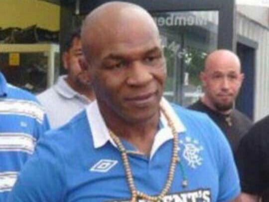 The boxing superstar was pictured wearing a Rangers top while leaving the gym in 2010. It was outside the Smackdown gym in Peterborough where this image was snapped.