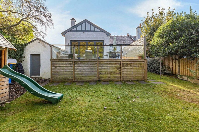 The rear garden is a great private space that is surrounded by mature trees. 