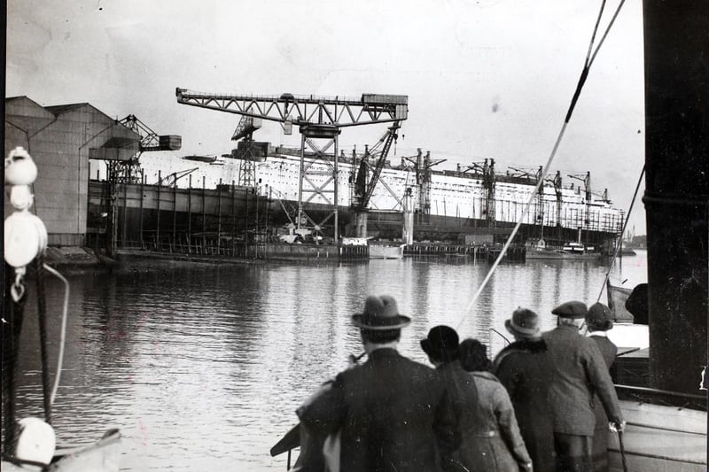 The ocean liner 'RMS Queen Mary' under construction on the River Clyde in Scotland, circa 1935.