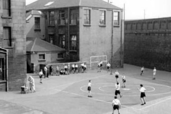 Children play while on break from a school on Duke Street