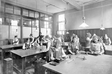 A group of young children at Whitehill School learn science in the early 20th century